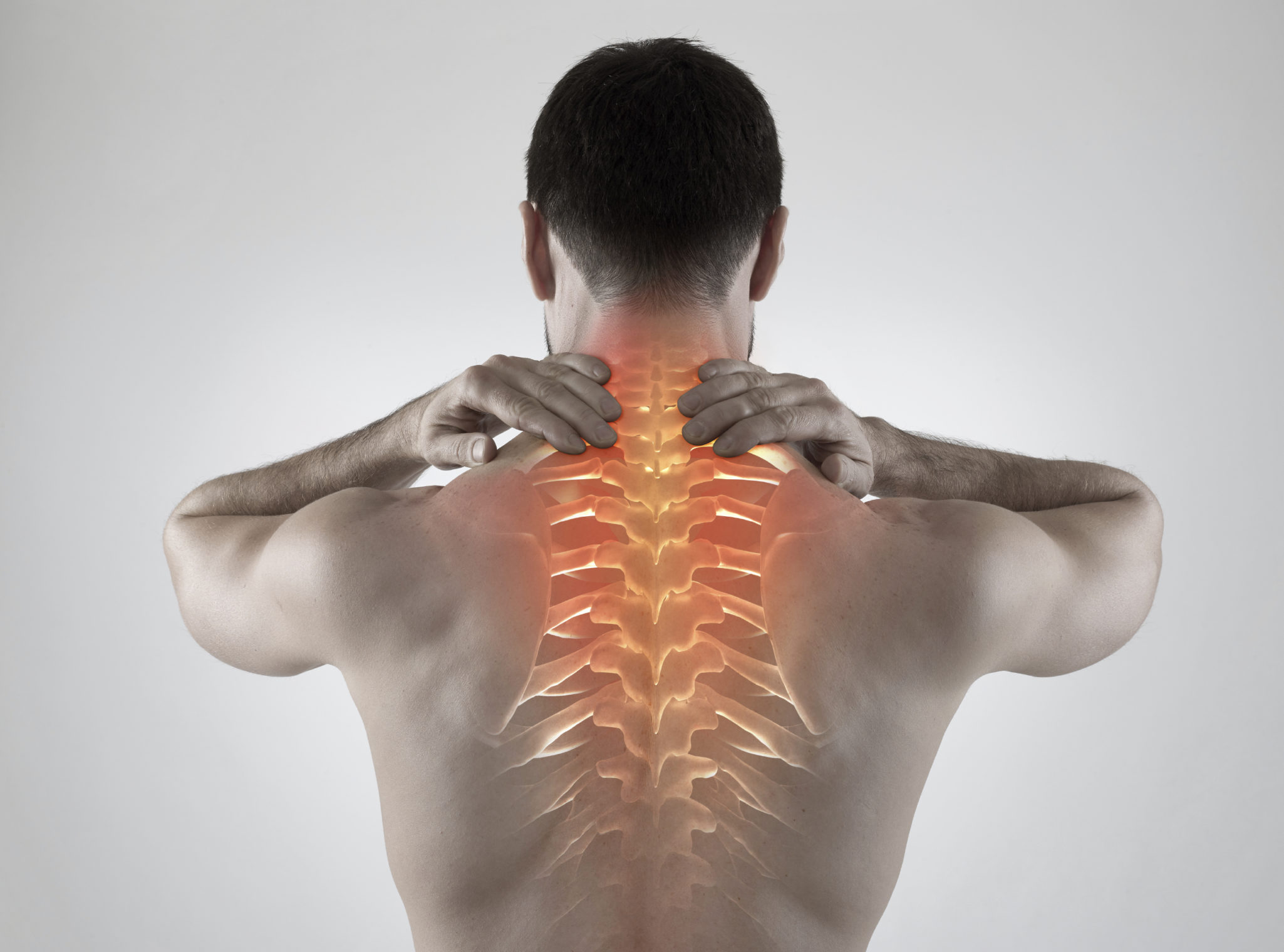 man clenching back with cross section of spine glowing red to represent pain from cervical fracture