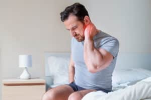 Man with neck pain due to cervical stenosis in Dallas, TX