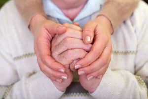 Man holding his hands together due to Essential Tremor in Dallas, TX