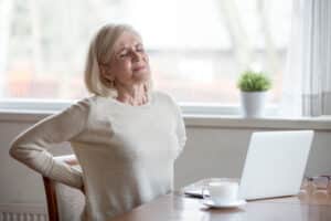Woman with back pain due to spinal cord tumor in Dallas, TX